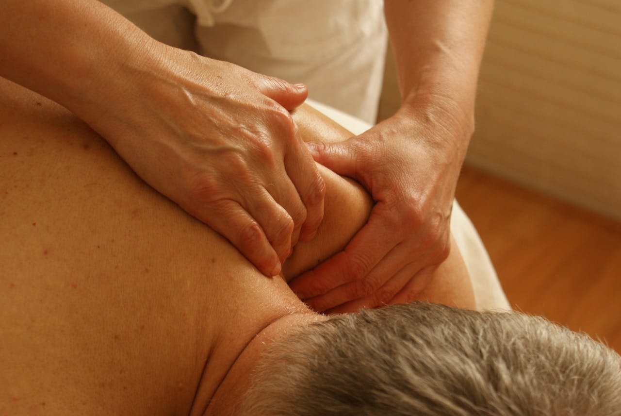 our-story Close-up of a therapist giving a relaxing shoulder massage, enhancing wellness and stress relief.